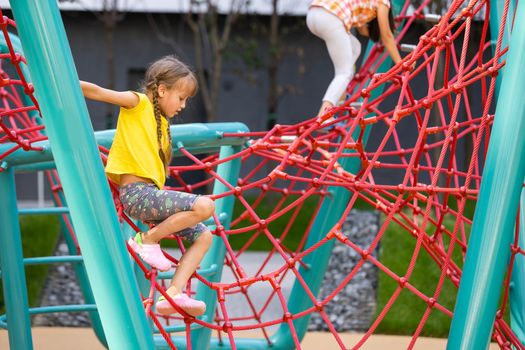 Happy children playing outdoors, children on the playground