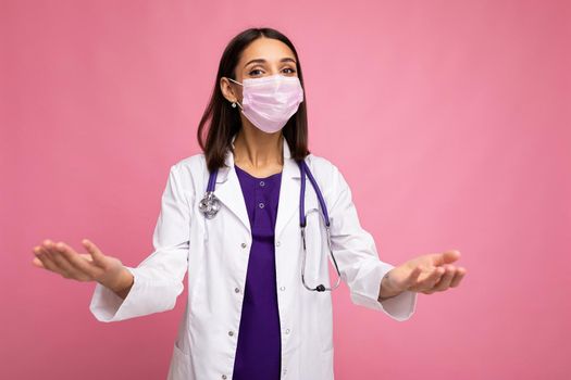 Coronavirus, healthcare and doctors concept. Portrait of professional confident young european doctor in medical mask and white coat, stethoscope over neck.