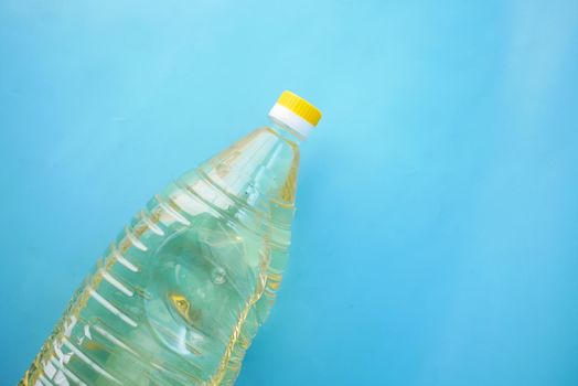 sunflower oil bottle on blue background ,