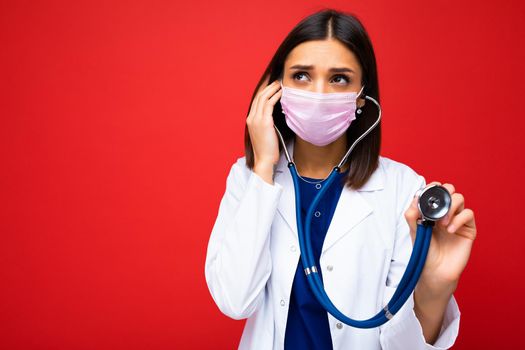 Doctor Wearing Medical Mask and Stethoscope isolated on background.