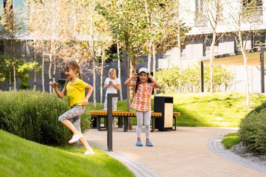 Happy children playing outdoors, children on the playground