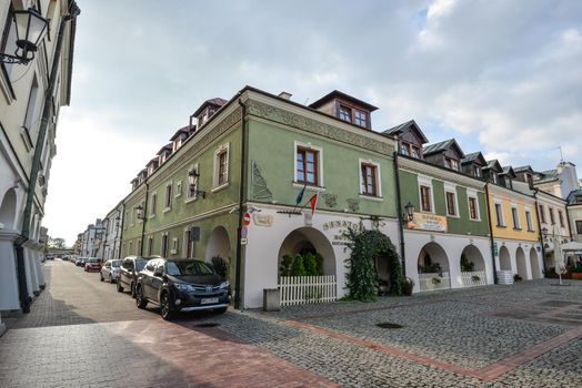 Zamosc, Poland - August 23, 2017: View on bright buildings of little town Zamosc, Poland