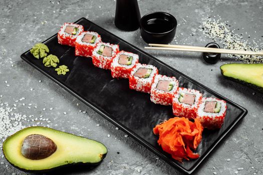 Sushi california roll with tuna in caviar.