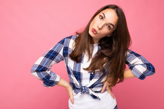 Photo shot of cute nice charming gorgeous attractive pretty youngster happy and funny woman wearing stylish clothes isolated over colorful background with copy space.