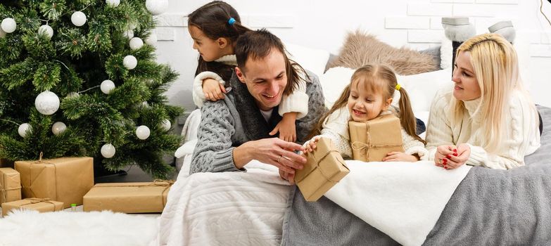 friendly family in Christmas morning.