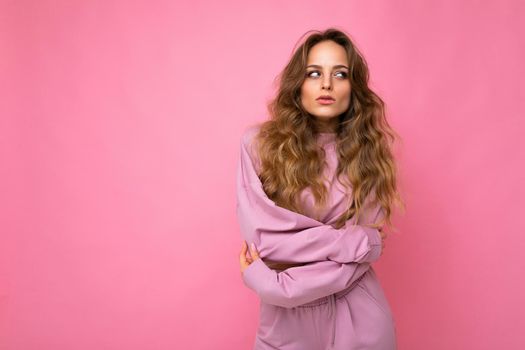 Close-up portrait of nice-looking attractive lovely lovable pretty cute winsome gorgeous cheerful cheery wavy-haired blonde woman isolated on pastel color background wearing stylish clothes.