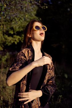 woman wearing sunglasses outdoors posing fashion. High quality photo