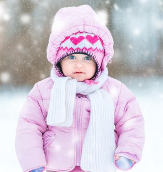 first snow. little girl enjoys the arrival of winter