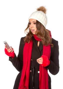 Portrait of the beautiful sexual girl in warm hat and coat on white background