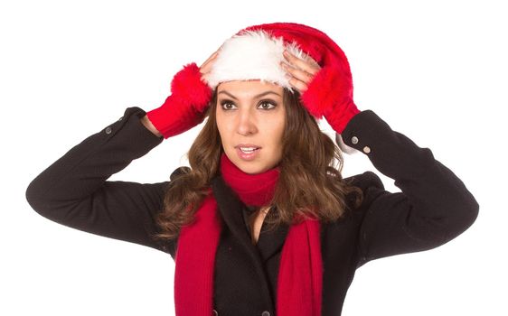 Funny harry Christmas girl with red fluffy Santa Hat. Isolated on white