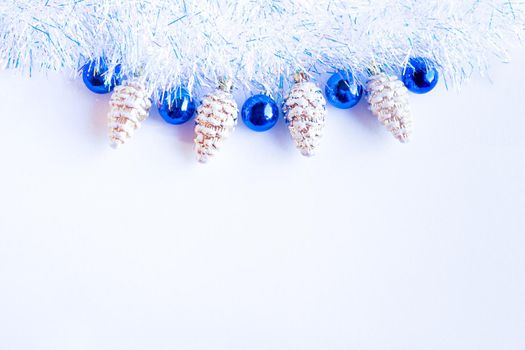 Christmas composition. Christmas decorations blue and gold on a light background. Flat lay, top view, copy space.