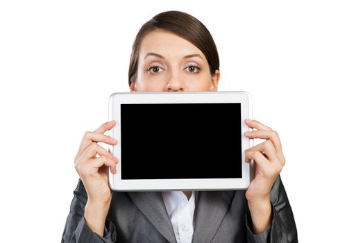 Businesswoman holding tablet computer with blank screen. Beautiful woman in business suit show tablet PC near her face. Corporate businessperson isolated on white background. Digital technology layout