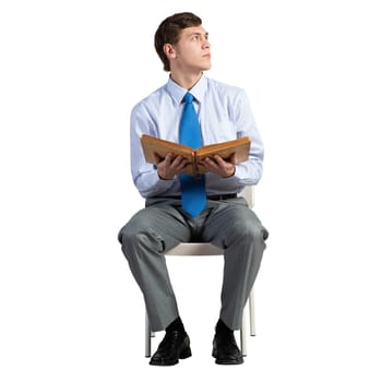 businessman sits on a white chair, with a book, isolated on white background