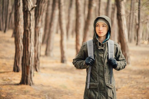 Hiker girl walking in forest