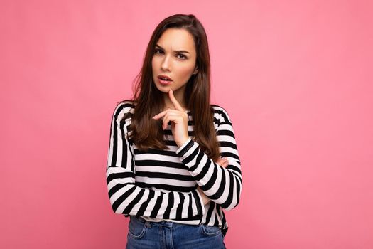 Closeup photo of amazing thoughtful beautiful young woman deep thinking creative female person holding arm on chin wearing stylish outfit isolated on colorful background with copy space.