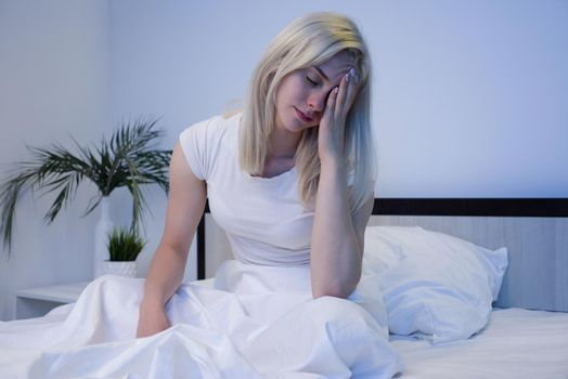 Depressed woman awake in the night, she is exhausted and suffering from insomnia - Image