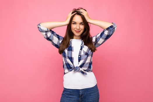 Photo shot of cute nice charming gorgeous attractive pretty youngster happy woman wearing stylish clothes isolated over colorful background with copy space.