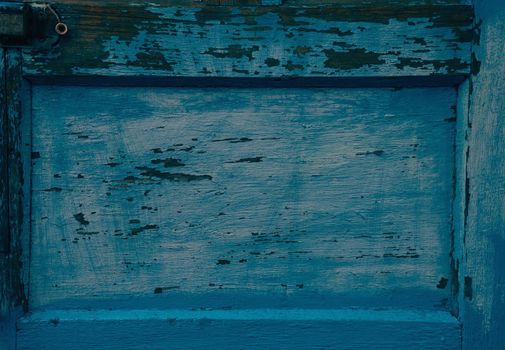 Old wooden plank of blue color, texture or background. Space for text