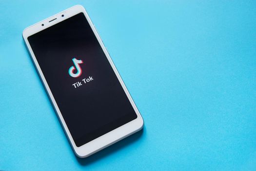 Tver, Russia - February 12, 2020 Tik tok logo on smartphone screen on green background. Tik Tok icon. tik tok application. Tiktok Social media network.