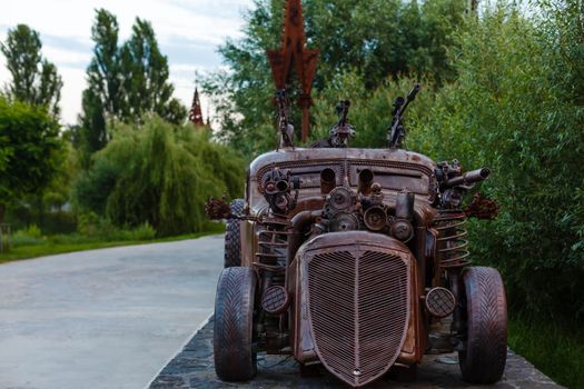 Gurivschina, Ukraine - July 04, 2020: Victoria film studio near Kiev. Film studio in the form of a castle with monsters, zombies car, hut and stranger.