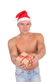 handsome young guy wearing Santa Claus cap, on white background, focus on the gift box