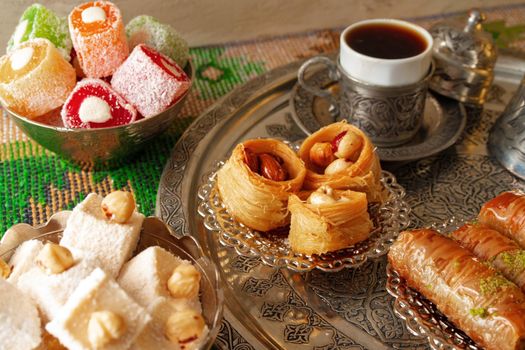 Turkish Coffee served with Turkish Delight on metal tray, close up