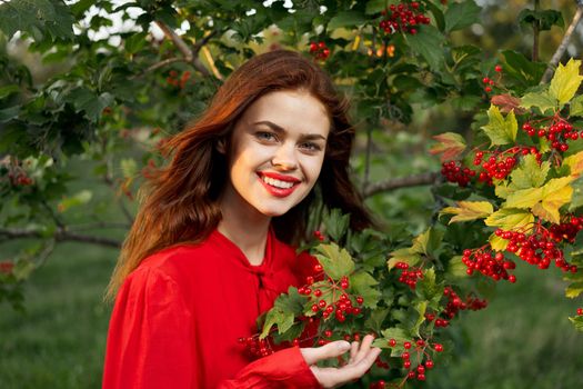 cheerful woman eating berries outdoors fresh air. High quality photo