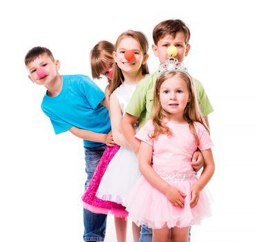 laughing children with clown noses standing one by one and holding each other