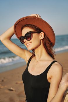 woman walking on the beach landscape sun fun lifestyle. High quality photo