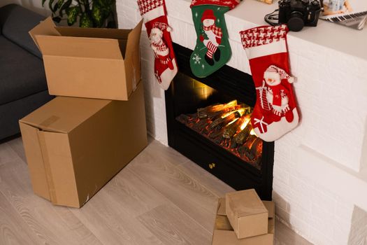 Vintage packages, delivery boxes near fireplace, Christmas