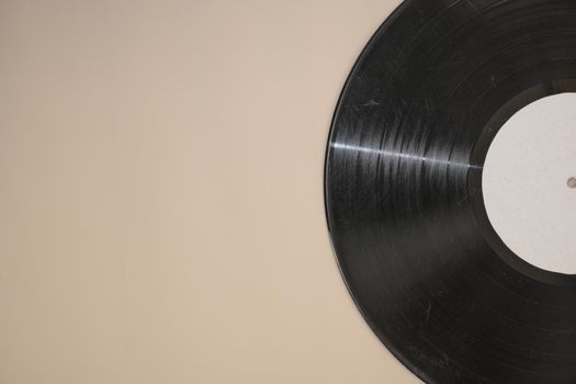 vinyl record on beige background.