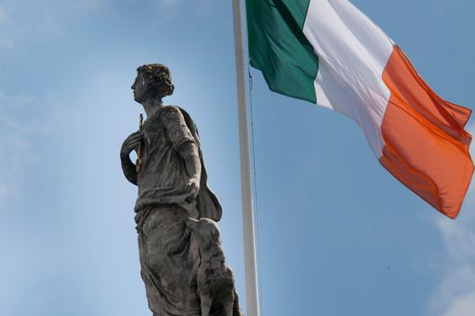 The statue of Fidelity with dog and the Irish tricolor on the General Post Office in Dublin Ireland
