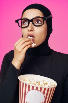 pretty woman attractive look popcorn glasses movie watching model ethnicity. High quality photo