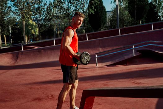 athletic man in red jersey workout exercise pumped up body. High quality photo