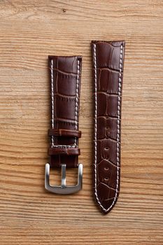 closeup brown crocodile grain leather watch band