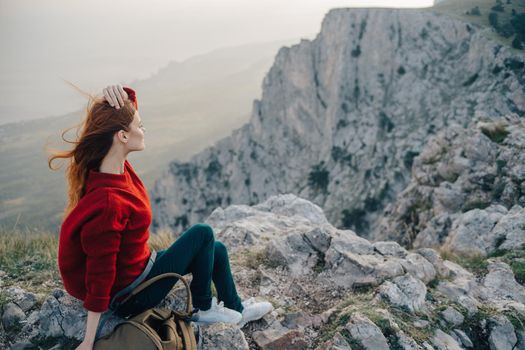 woman hiker sitting on mountain landscape nature fresh air. High quality photo