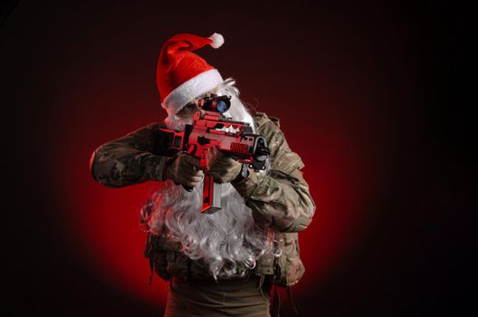 the man in a military uniform with a gun and a Santa Claus hat