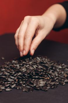 natural product sunflower seeds handing close-up food. High quality photo