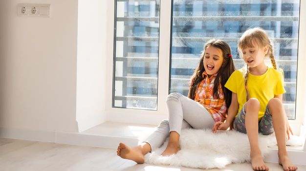 Creative cute girls, two sisters at home