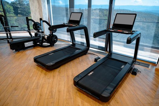 Studio shot of a professional treadmill in a modern gym