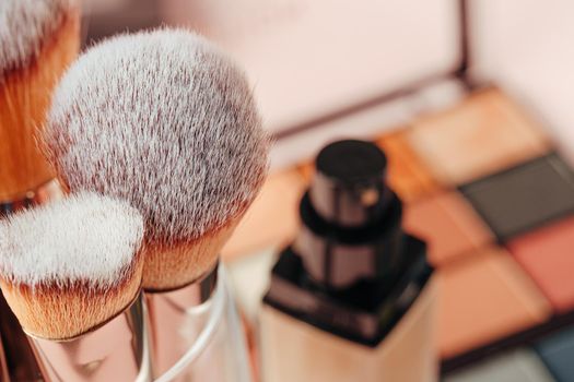 Make-up palette and brushes. Professional eyeshadow palette. Close up.