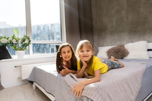 Tho little sisters together in bed