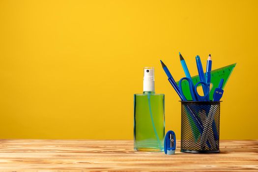 School stationery and hand sanitizer. Back to school concept while coronavirus pandemic 2020