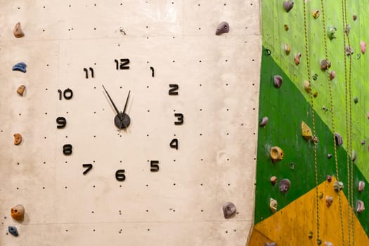 white round clock shows the time one hours isolate on white
