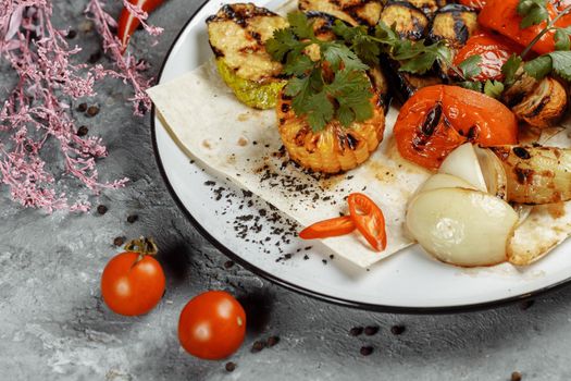 grilled vegetables on a white plate. Grilled fresh vegetables.