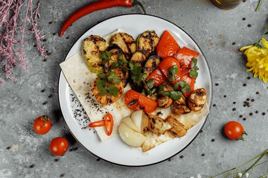 grilled vegetables on a white plate. Grilled fresh vegetables.