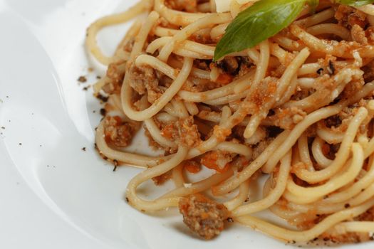Spaghetti pasta with bolognese sauce and parmesan cheese, top view.