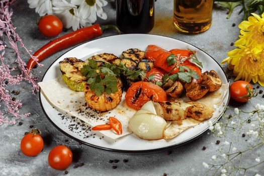 grilled vegetables on a white plate. Grilled fresh vegetables.