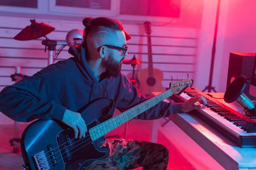 Musician and making music concept - Male sound producer working in recording studio