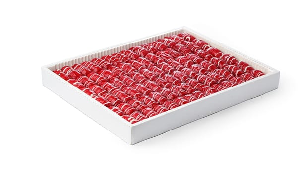 Assortment of Turkish baklava dessert in a white box isolated on white background